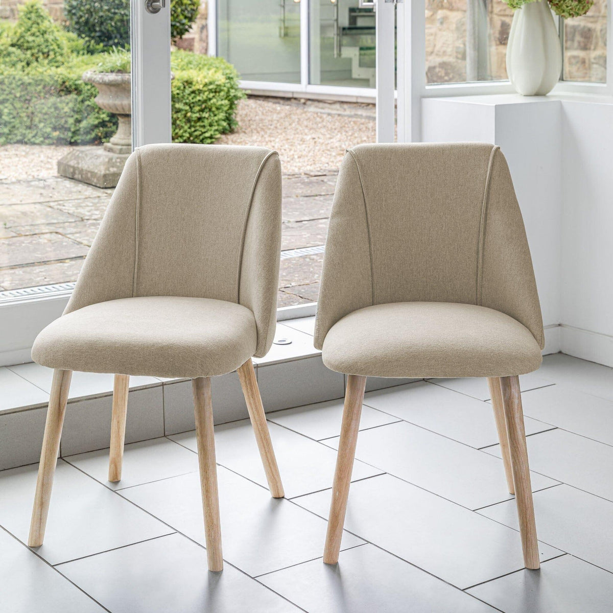 Marlon Whitewash Oak Round Dining Table Set - 4 Seater - Freya Sand Dining Chairs - Whitewash Oak Legs